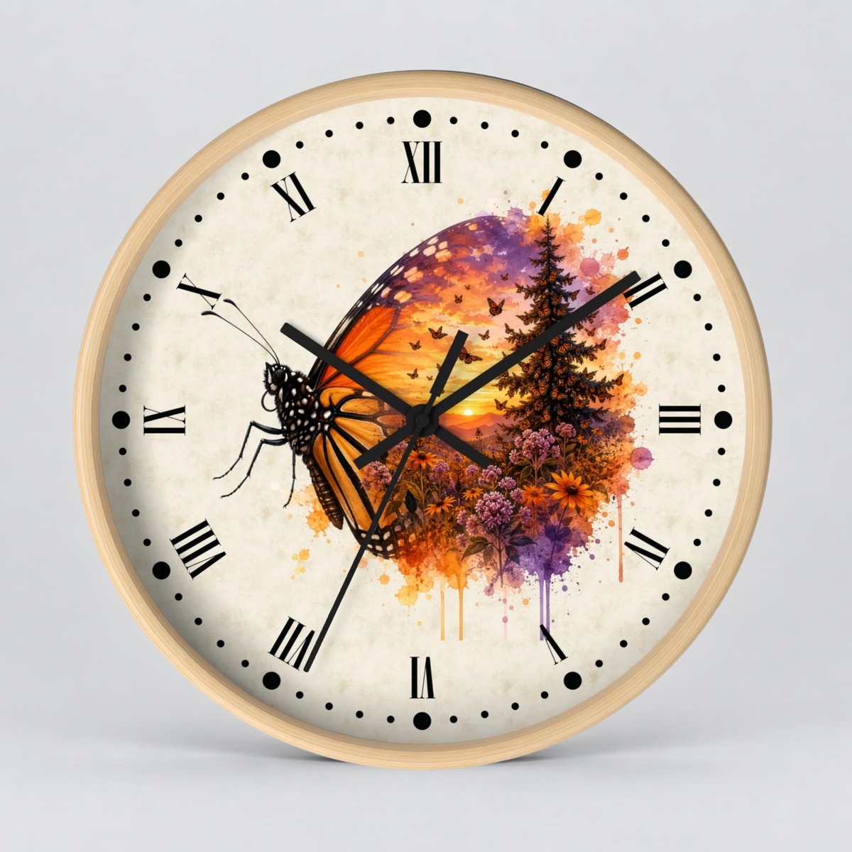 Round wall clock with a light wood frame and a cream-colored face featuring a colorful butterfly and floral sunset illustration, set against a neutral gray background.