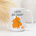White mug with cartoon Capybaras celebrating a birthday and 'Cappy Birthday!' text.