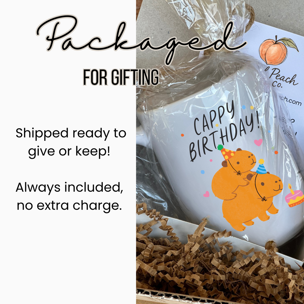 Gift-wrapped mug with 'Happy Birthday!' design, labeled 'Artful Peach Co'.