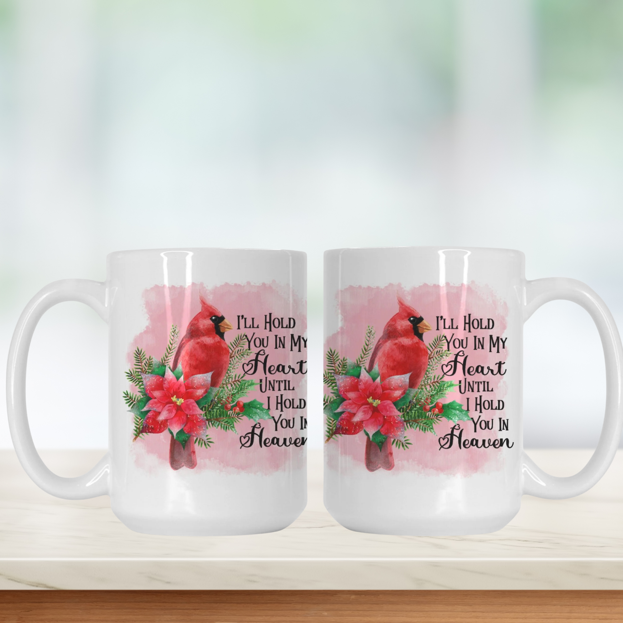 Two mugs with cardinal birds and floral designs on a white background