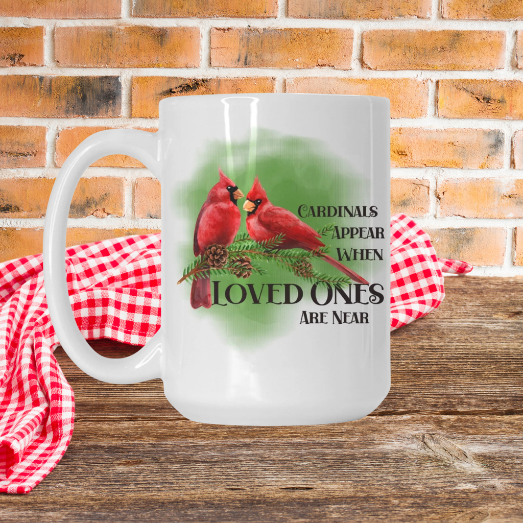 Frosted mug with cardinal design and text on a wooden surface with a red and white checkered cloth and brick wall background.