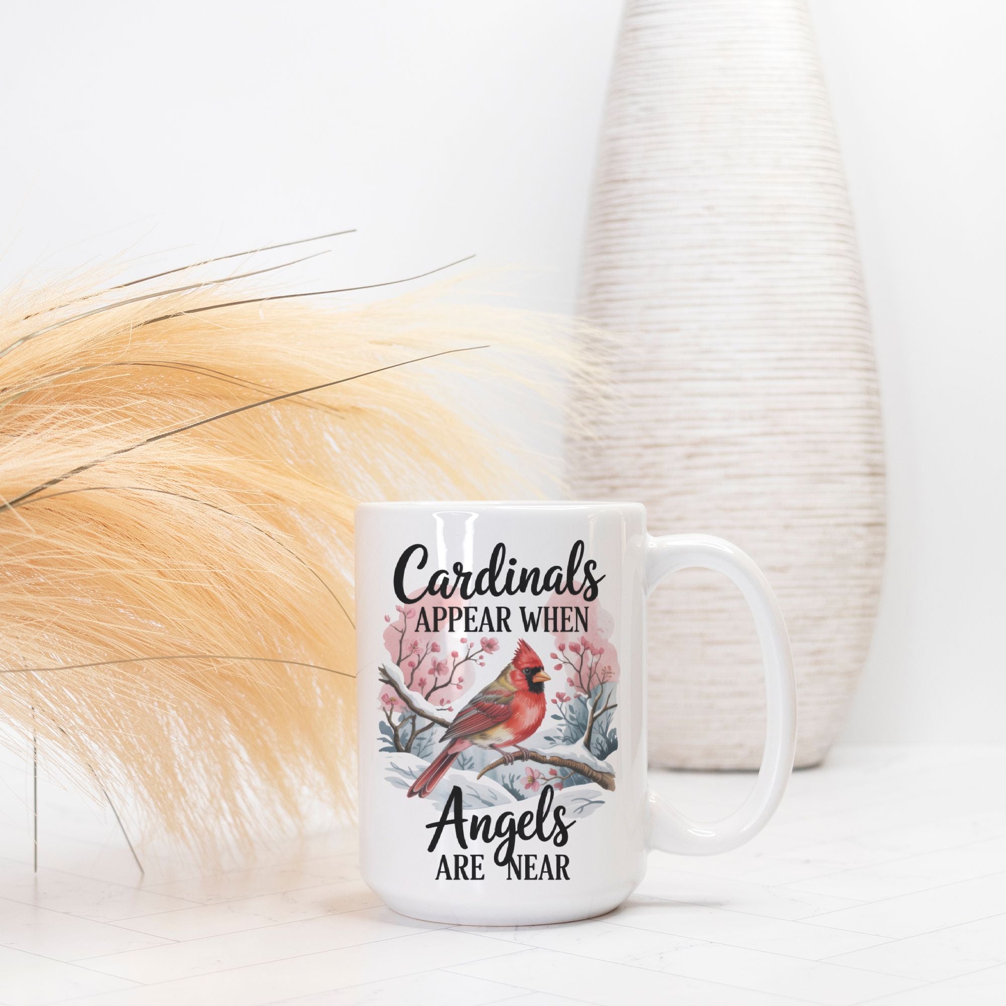 White mug with cardinal design and text on a white background