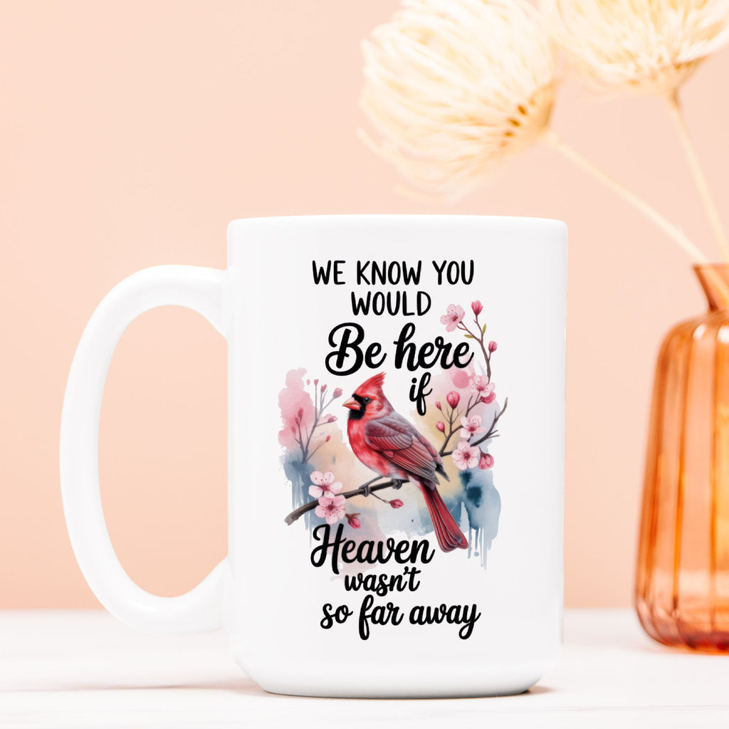 White mug with a cardinal design and text on a light pink background