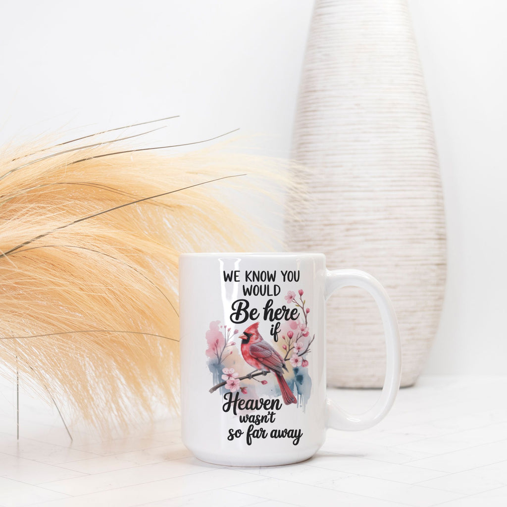 White mug with a bird design and text on a white background