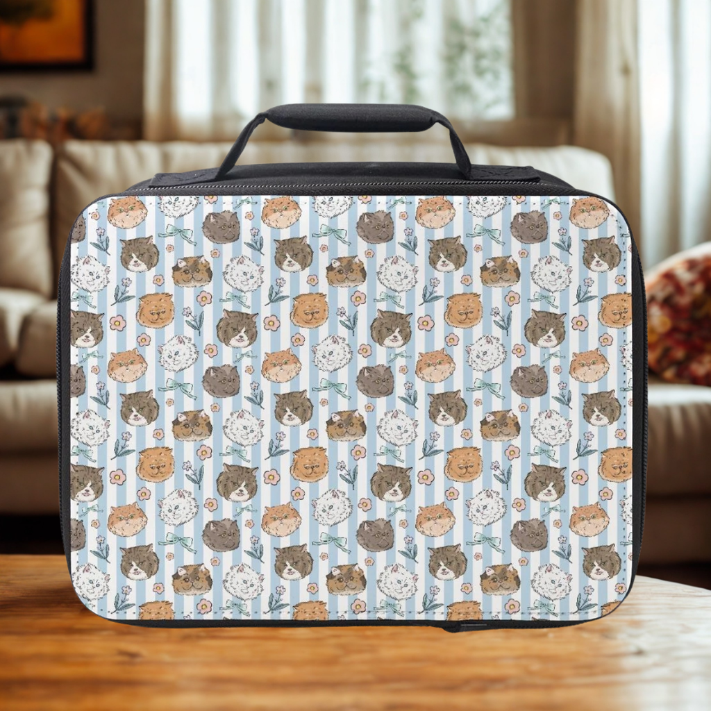  insulated lunch bag with cat pattern on a wooden table in a cozy living room