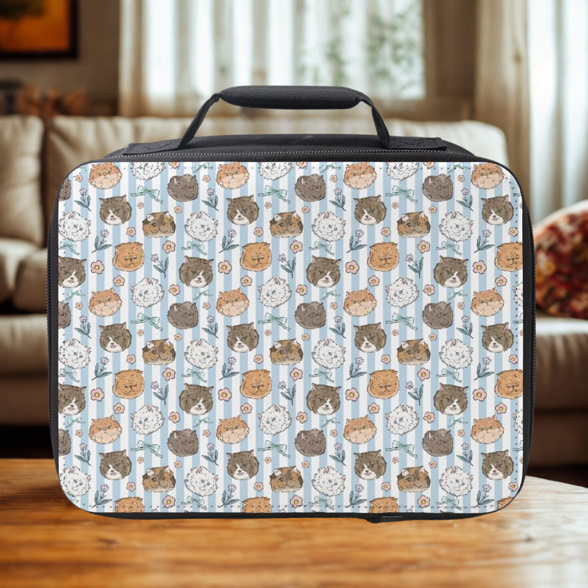  insulated lunch bag with cat pattern on a wooden table in a cozy living room