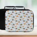 Insulated lunch bag with a hand drawn cat pattern on a wooden surface