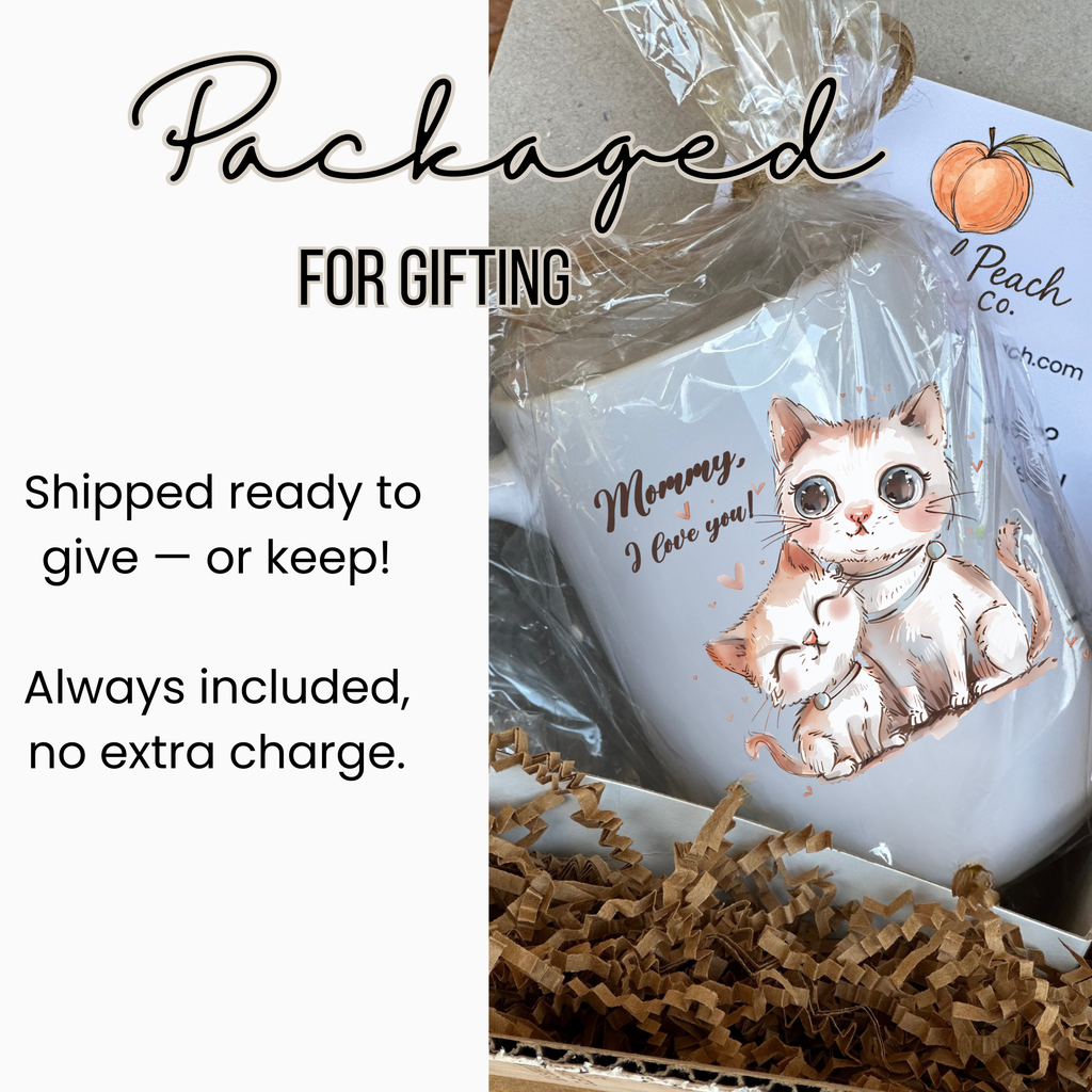 Cat-themed mug in clear packaging tied with twine inside a white gift box  with text about gifting.