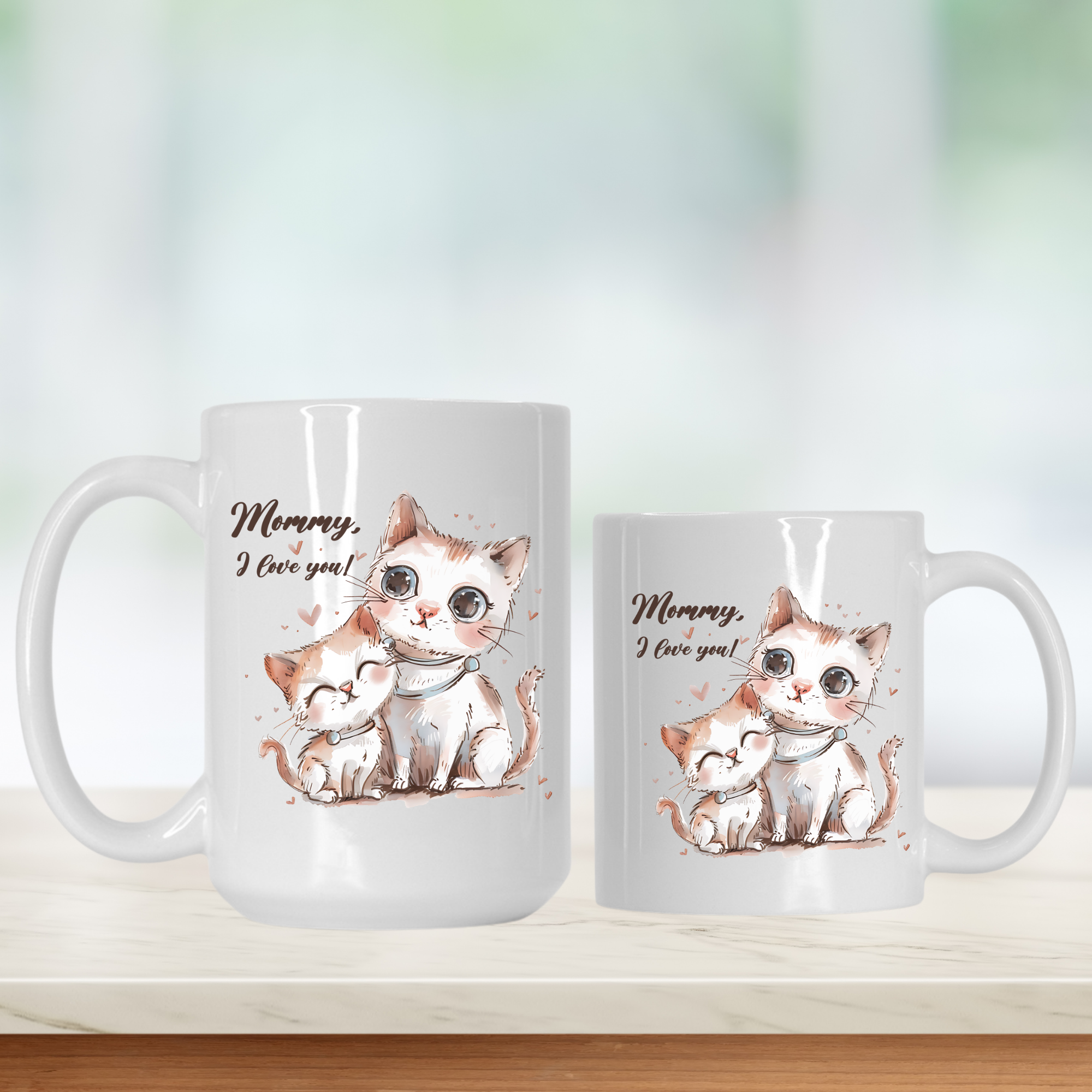Two white mugs with cat illustrations and 'Mommy, I love you!' text on a light background.