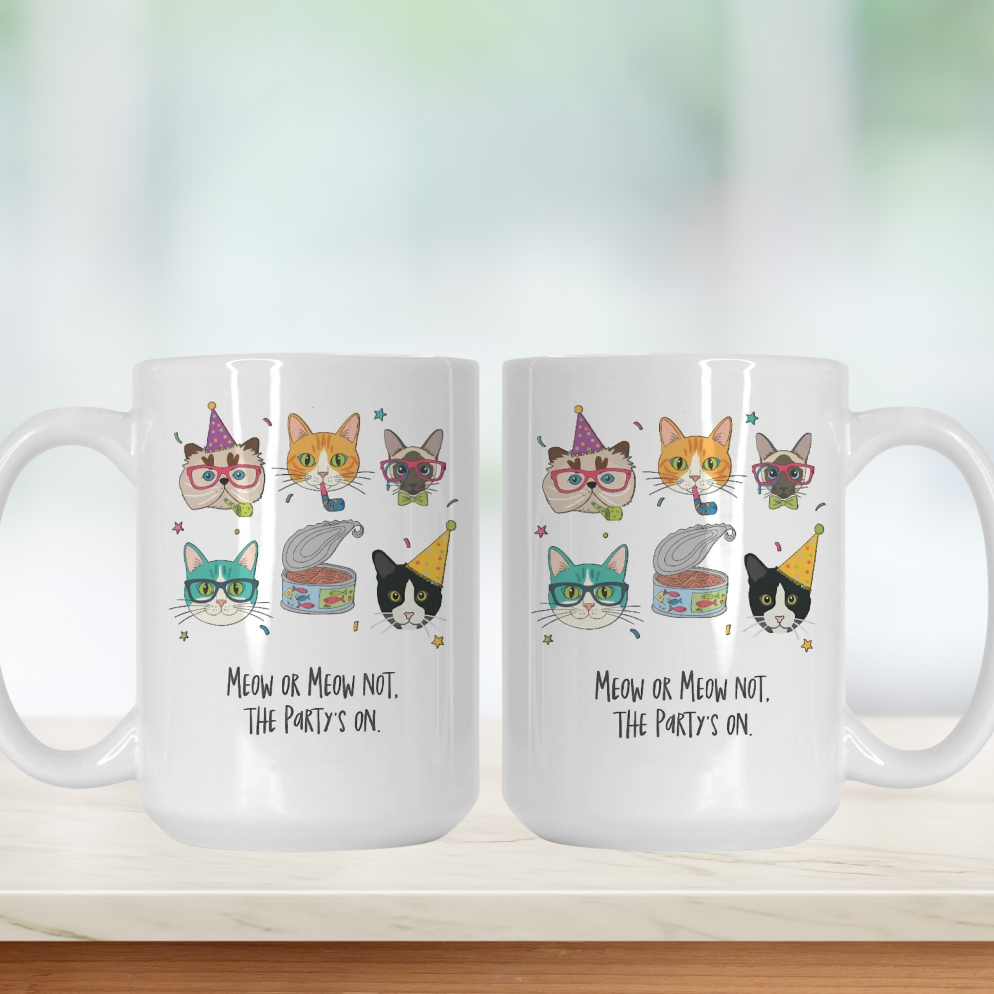 Two white mugs with cat-themed designs and text on a light background