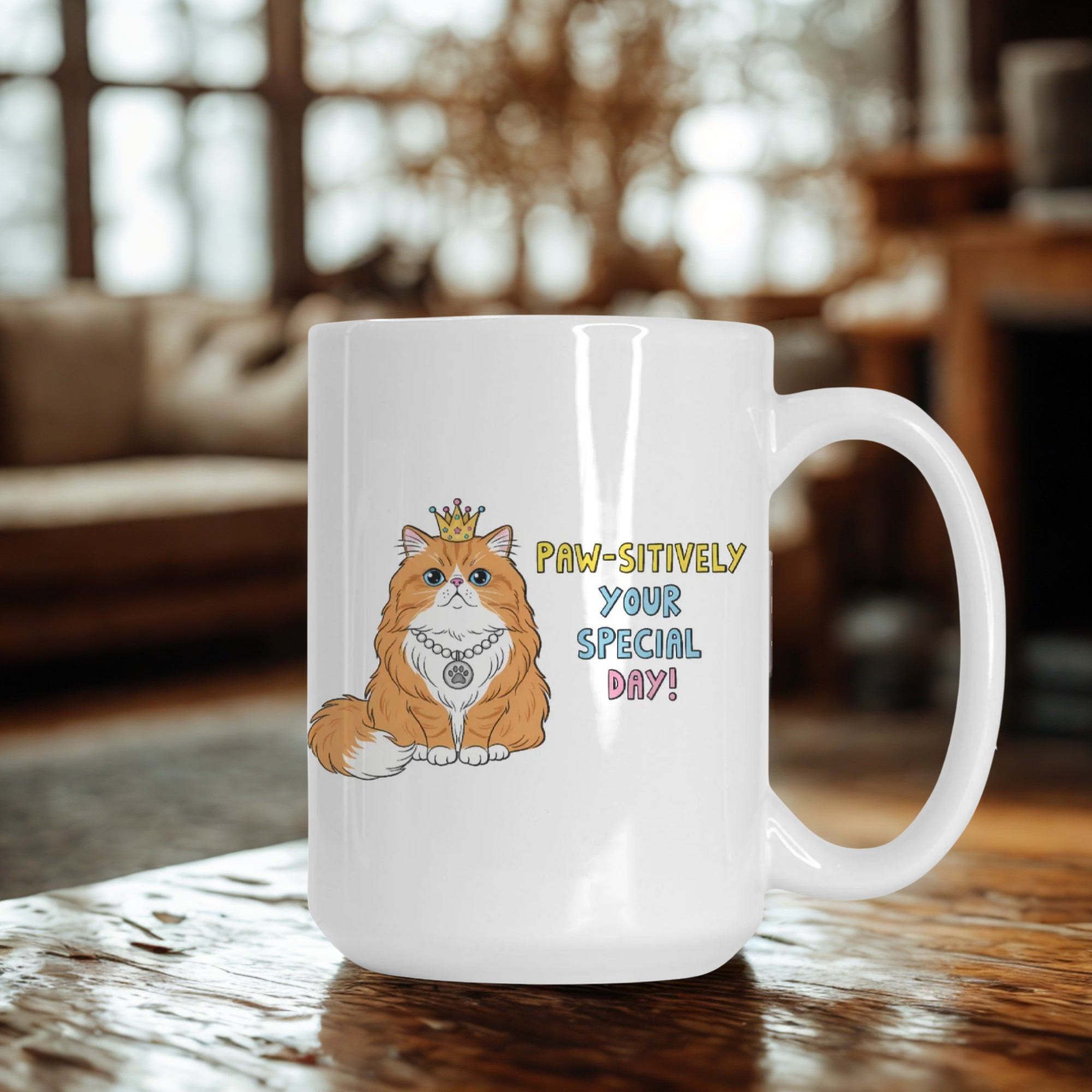 White mug with a cat illustration and text on a wooden table in a cozy room.