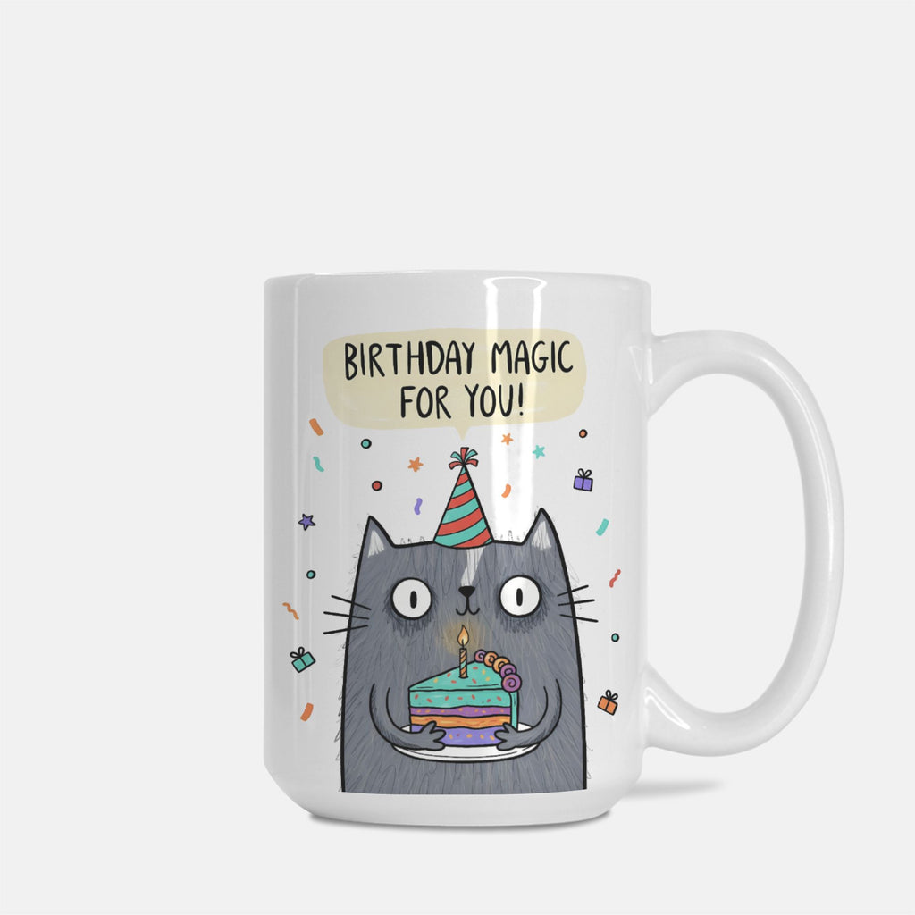 Mug with a cartoon cat holding a birthday cake and the text 'Birthday magic for you!' on a white background.