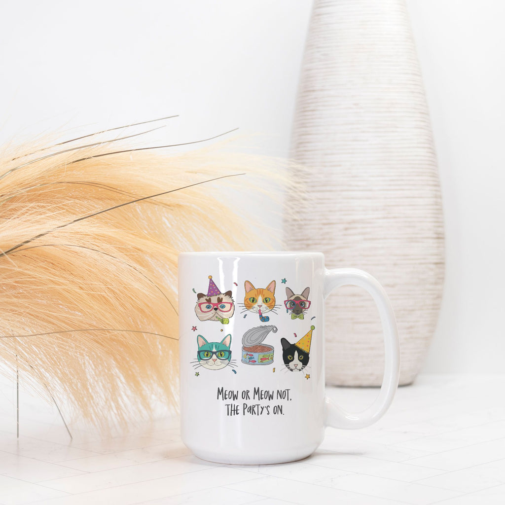 White mug with cat-themed designs and text on a white background