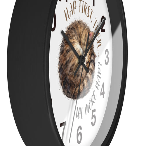 Side view of a round black wall clock with a cat illustration and humorous text on a white background