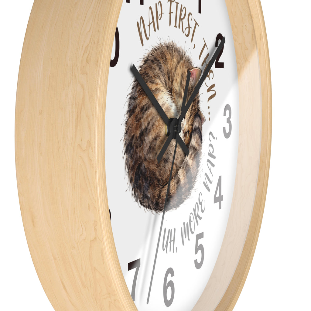 Side view of a round wood wall clock with a cat illustration and humorous text on a white background