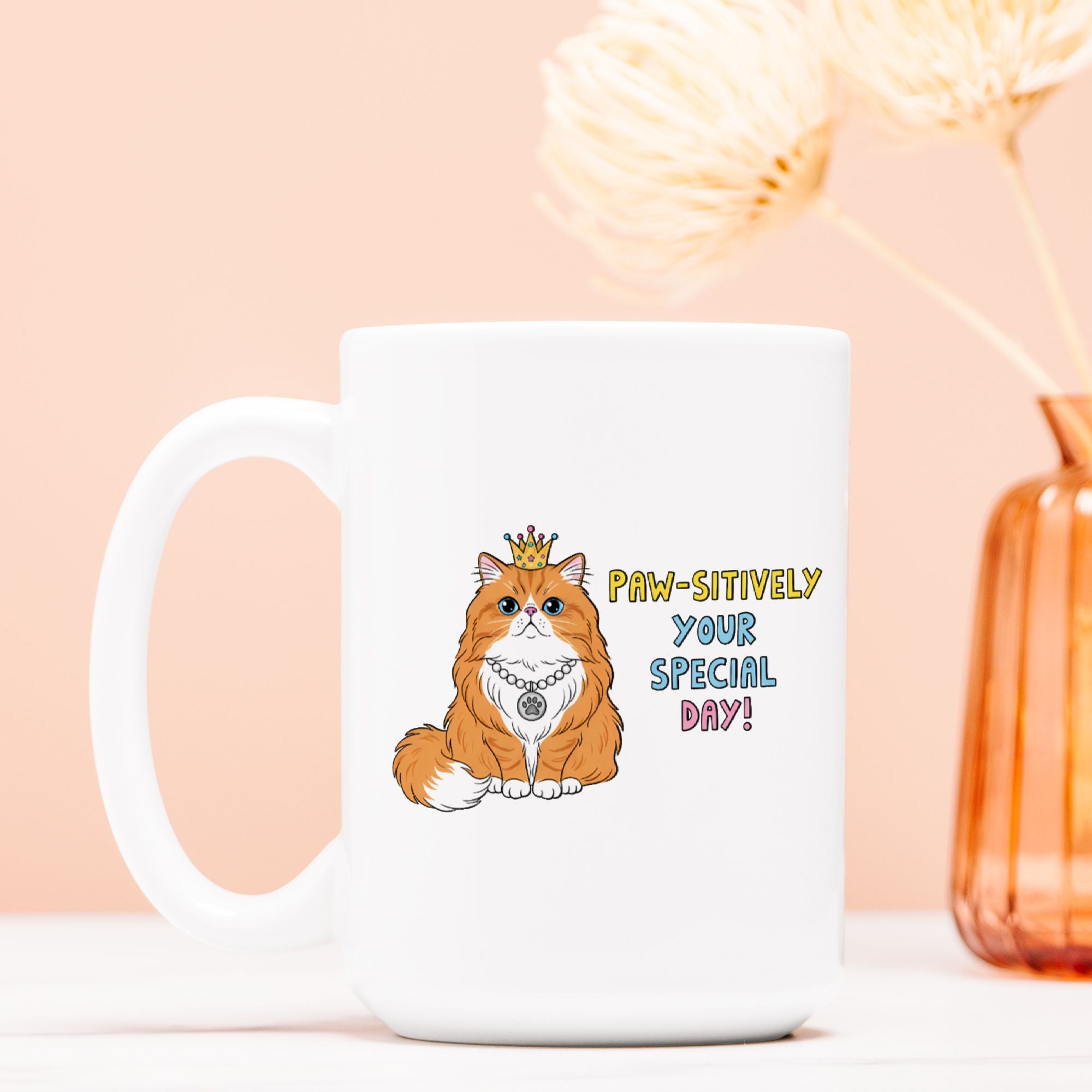 White mug with a cat illustration and birthday text on a peach background