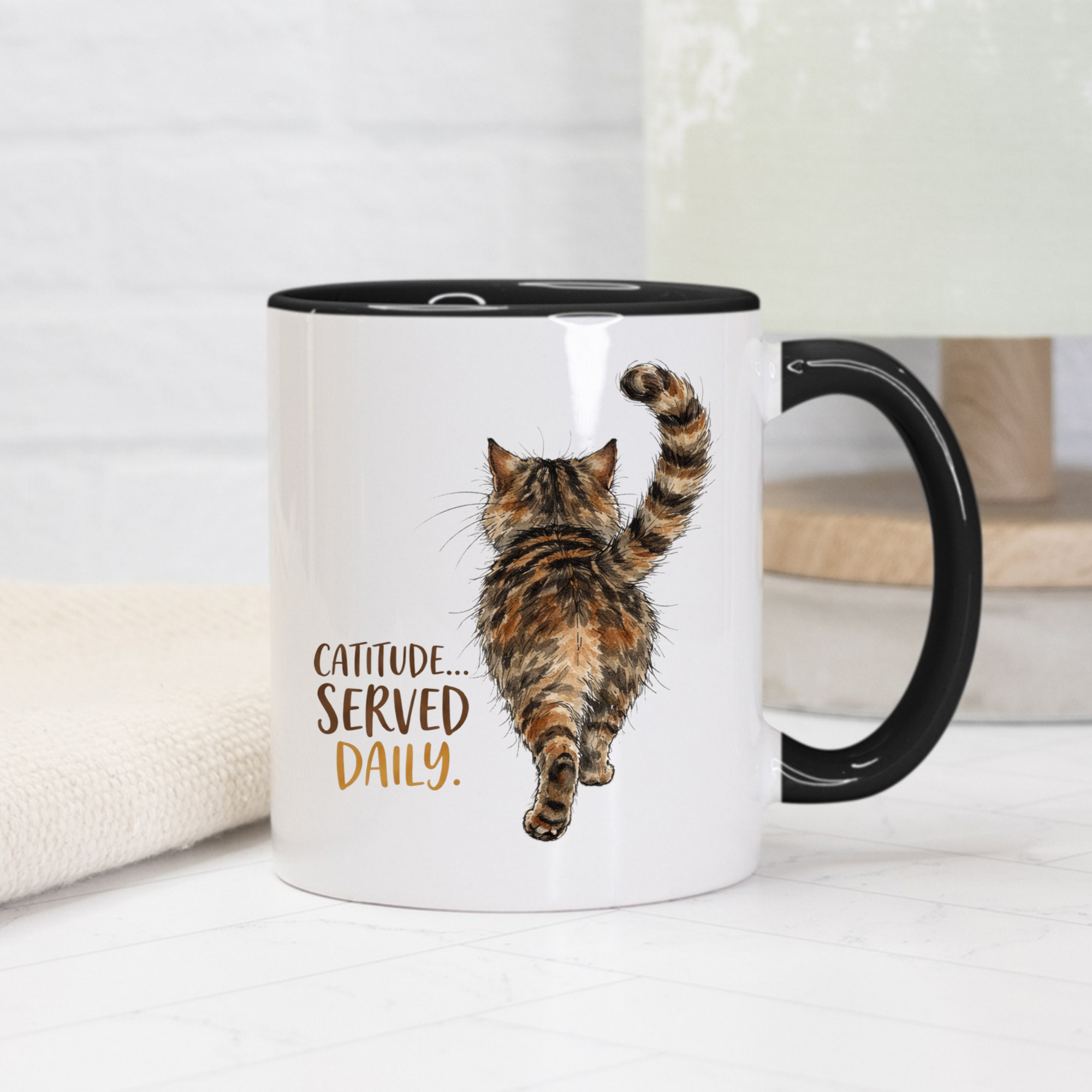 Black accent mug with a cat illustration and 'Catitude... Served Daily.' text on a white background
