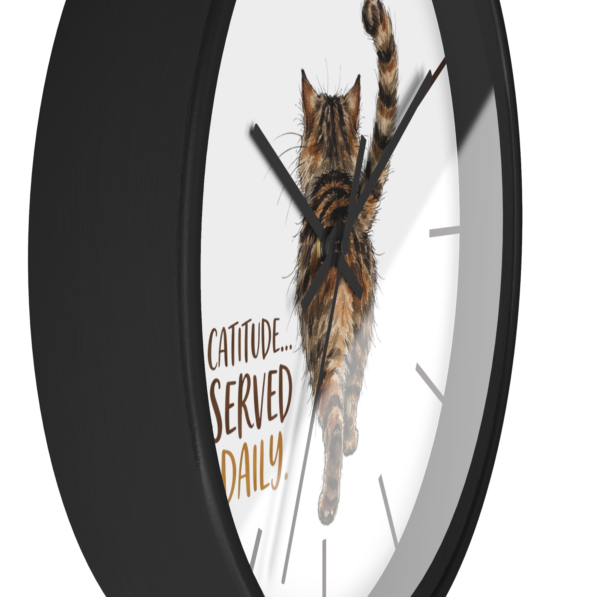 Side view of a round black wall clock with a cat design and 'Catitude Served Daily' text on a white background