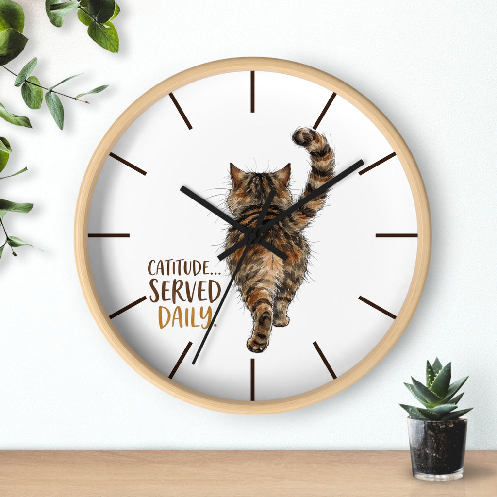 Round wood wall clock with a cat illustration and 'Catitude Served Daily' text, surrounded by plants.