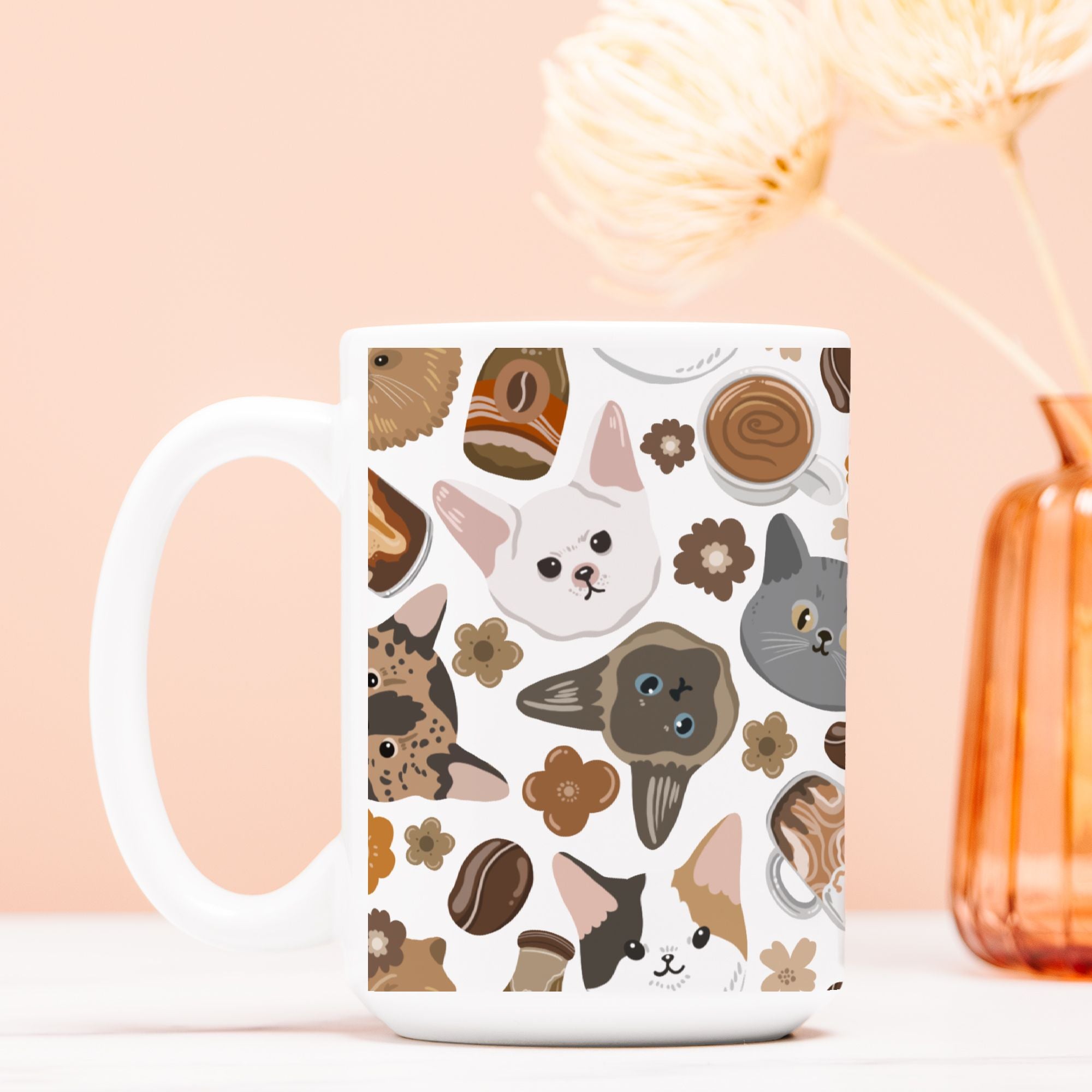 White mug with cat pattern on a light pink background