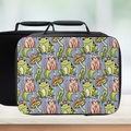 Lunch bag with a colorful pattern of frogs, cats, and mushrooms on a blue background.