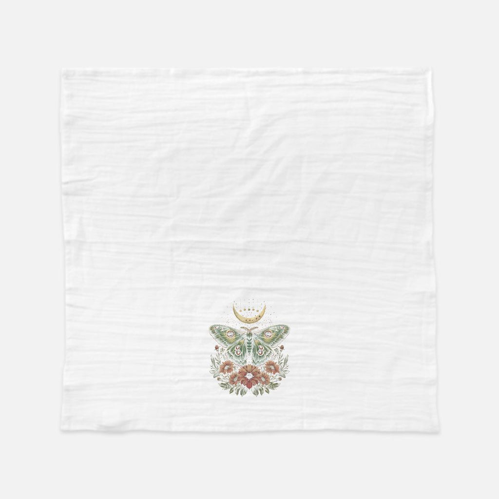 White towel with floral butterfly design in the center