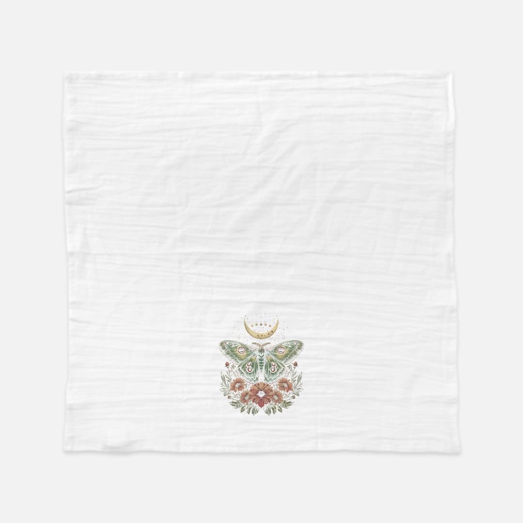 White towel with floral butterfly design in the center