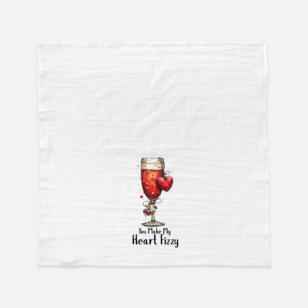 Tea towel with Wine glass graphic with red liquid and heart shapes and text 'You Make My Heart Fizzy' on a white background