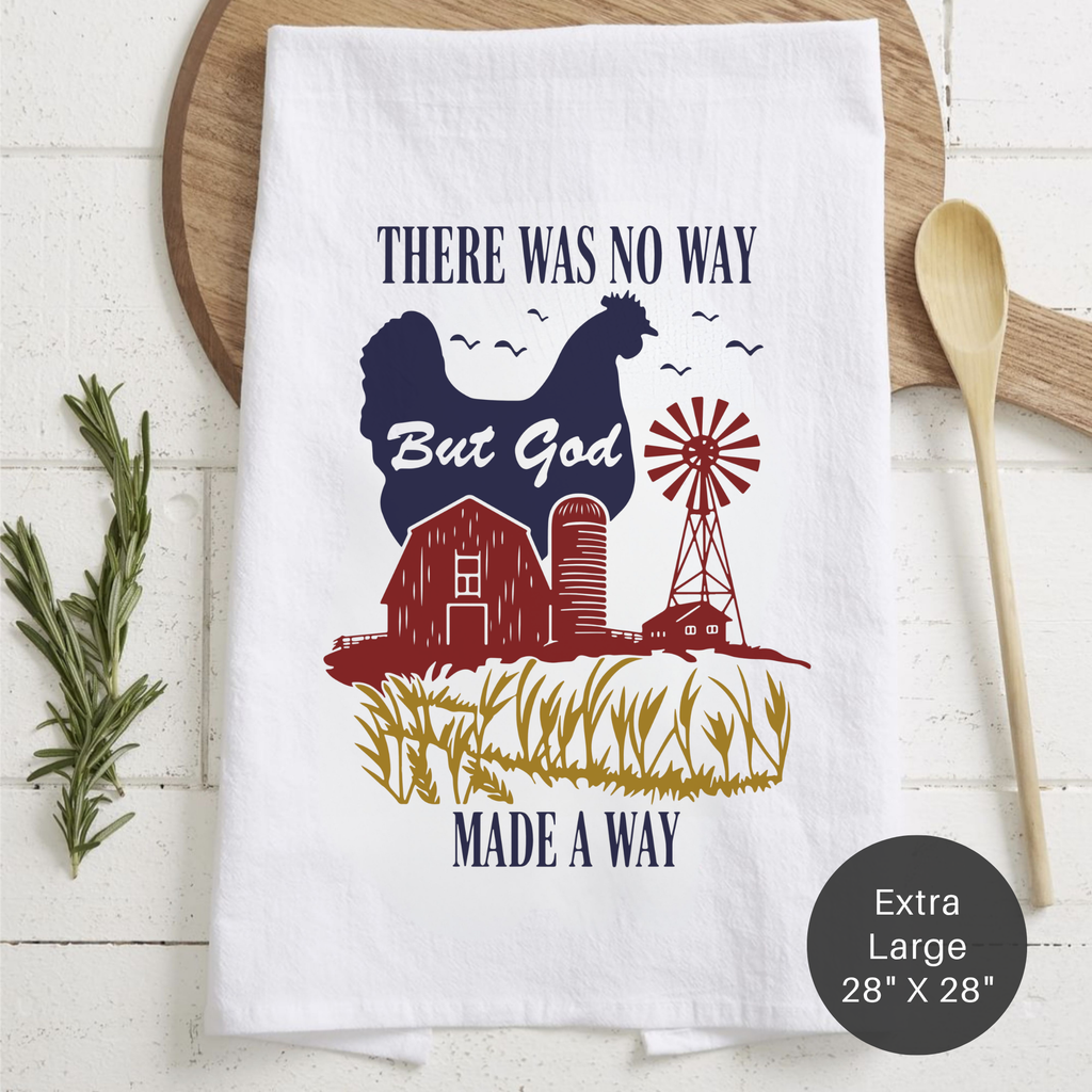 White tea towel with farm-themed design and text on a wooden surface