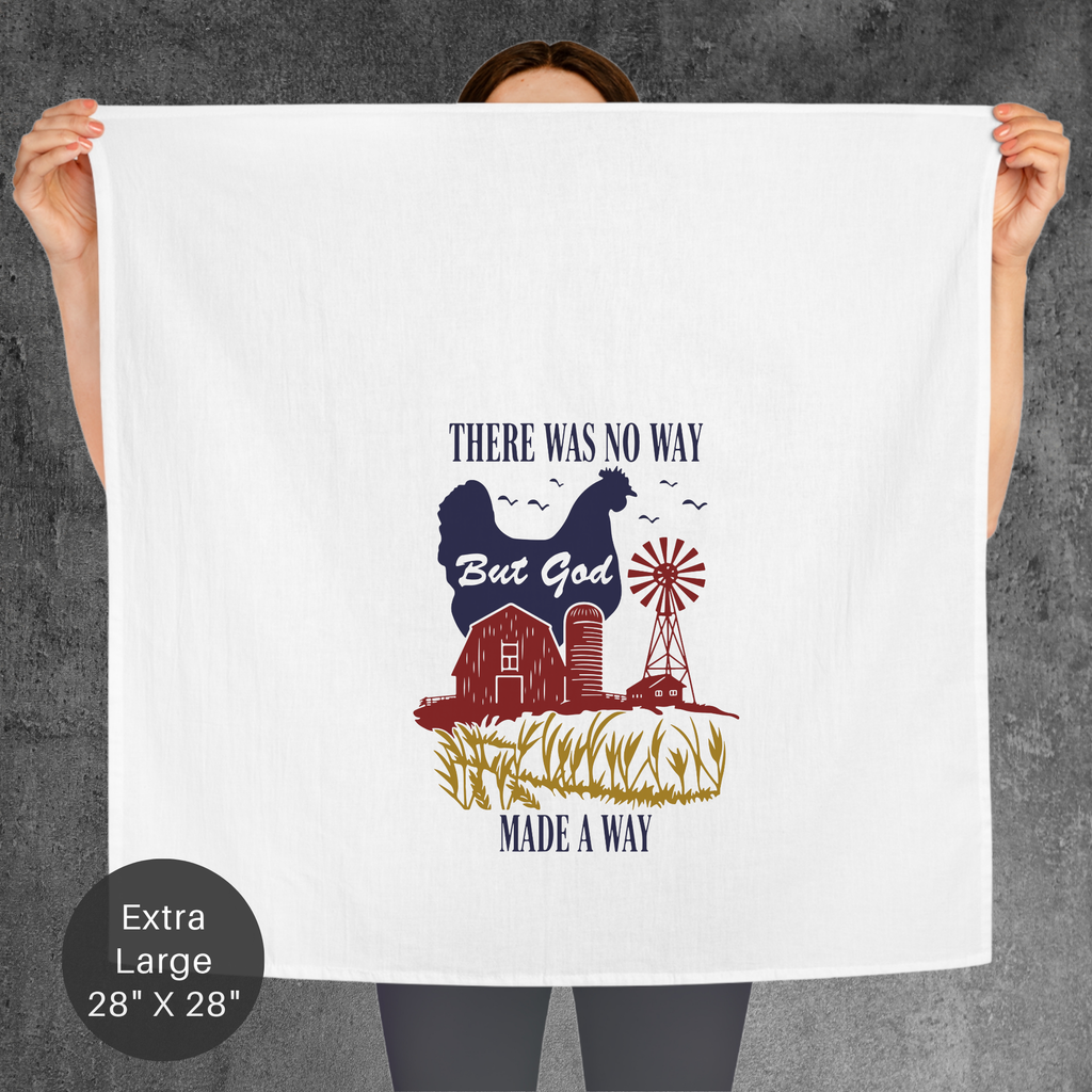 Person holding a large white tea towel with a graphic design and text on a gray background