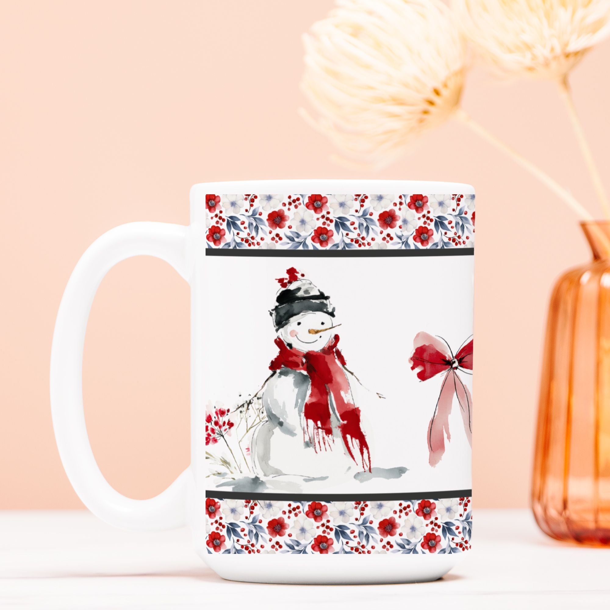 White mug with a snowman design and floral patterns on a peach background