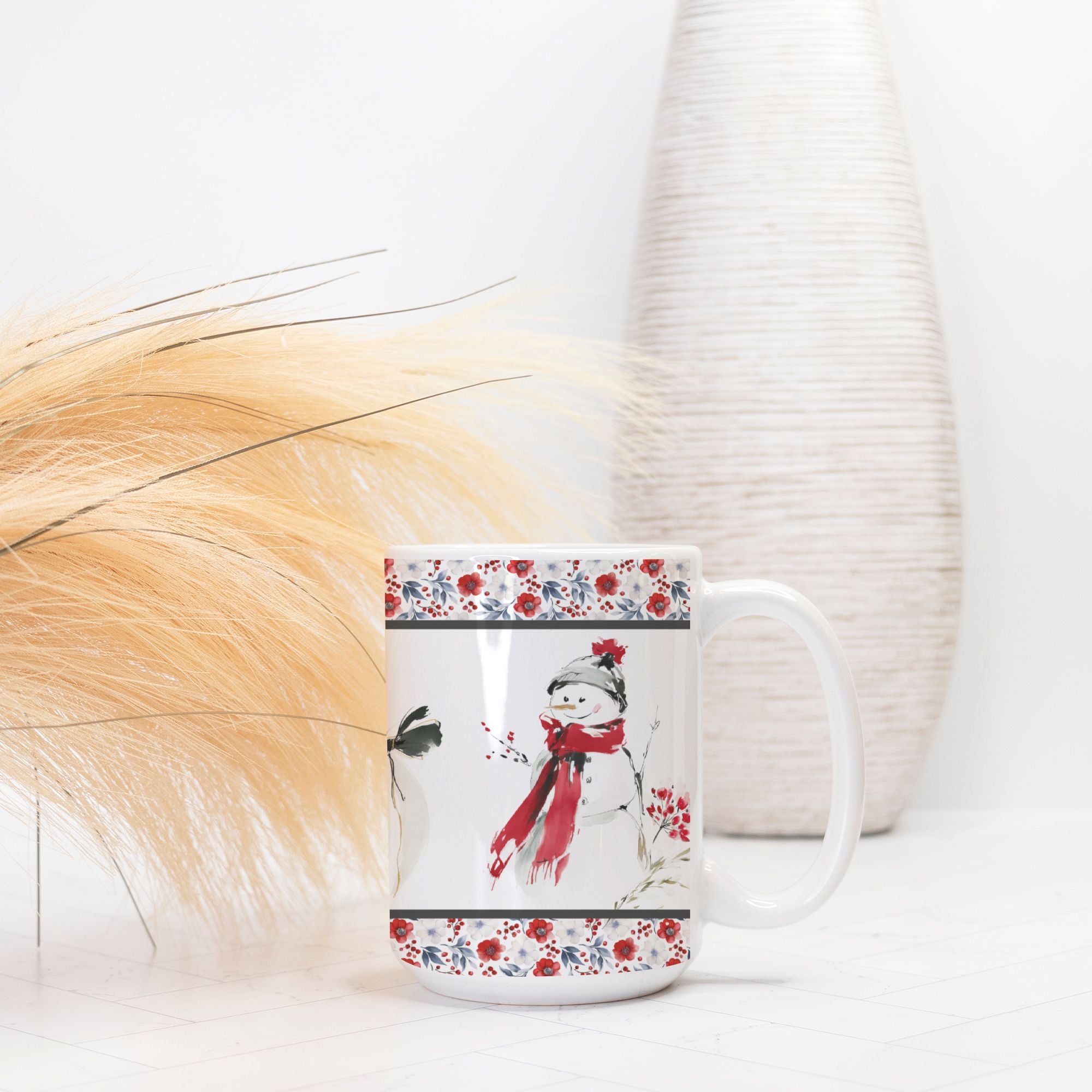Mug with a snowman design and floral patterns on a white surface