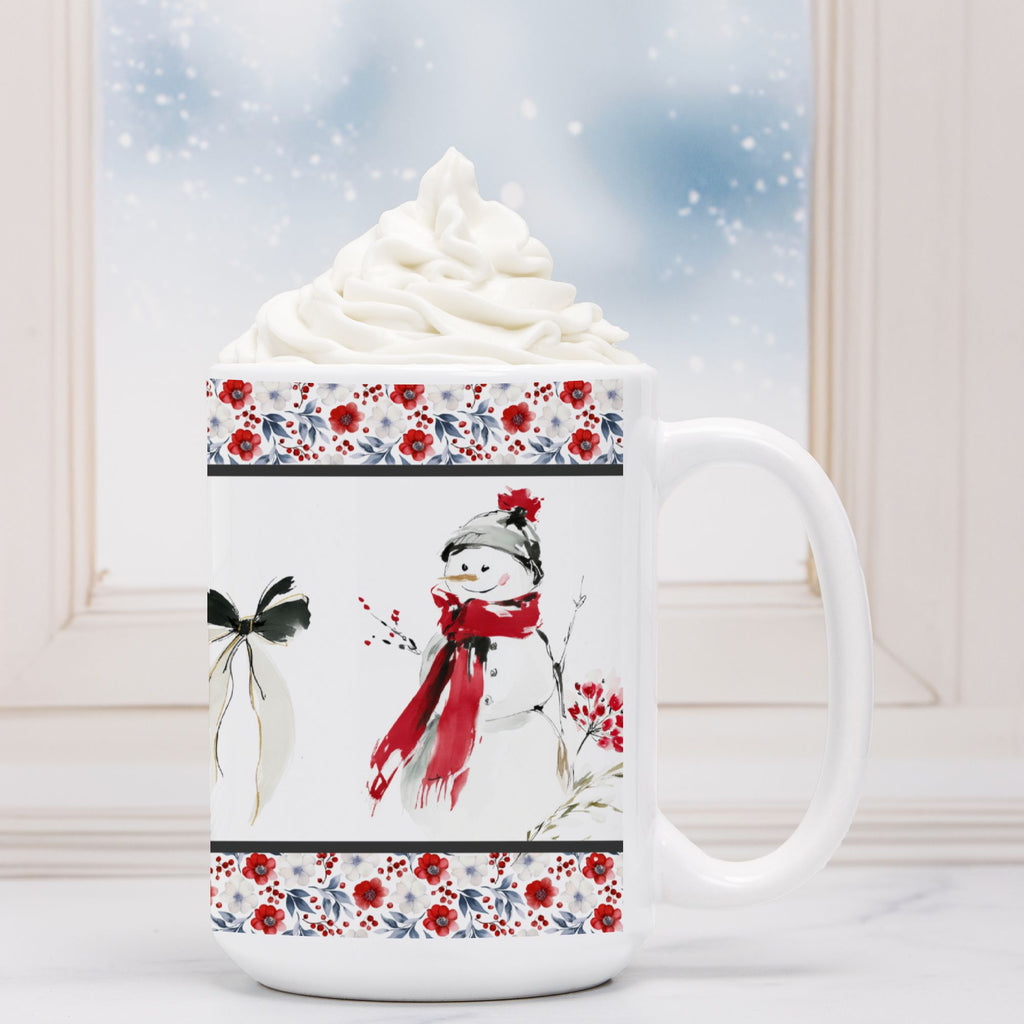 White mug with snowman design and floral patterns, filled with hot chocolate and whipped cream.