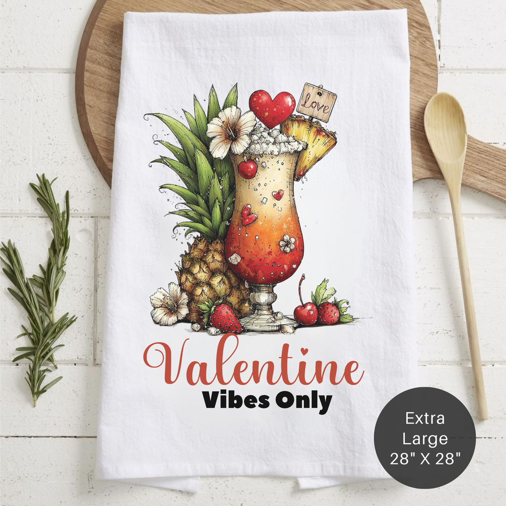 Valentine-themed towel with tropical drink design and 'Valentine Vibes Only' text on a wooden surface.