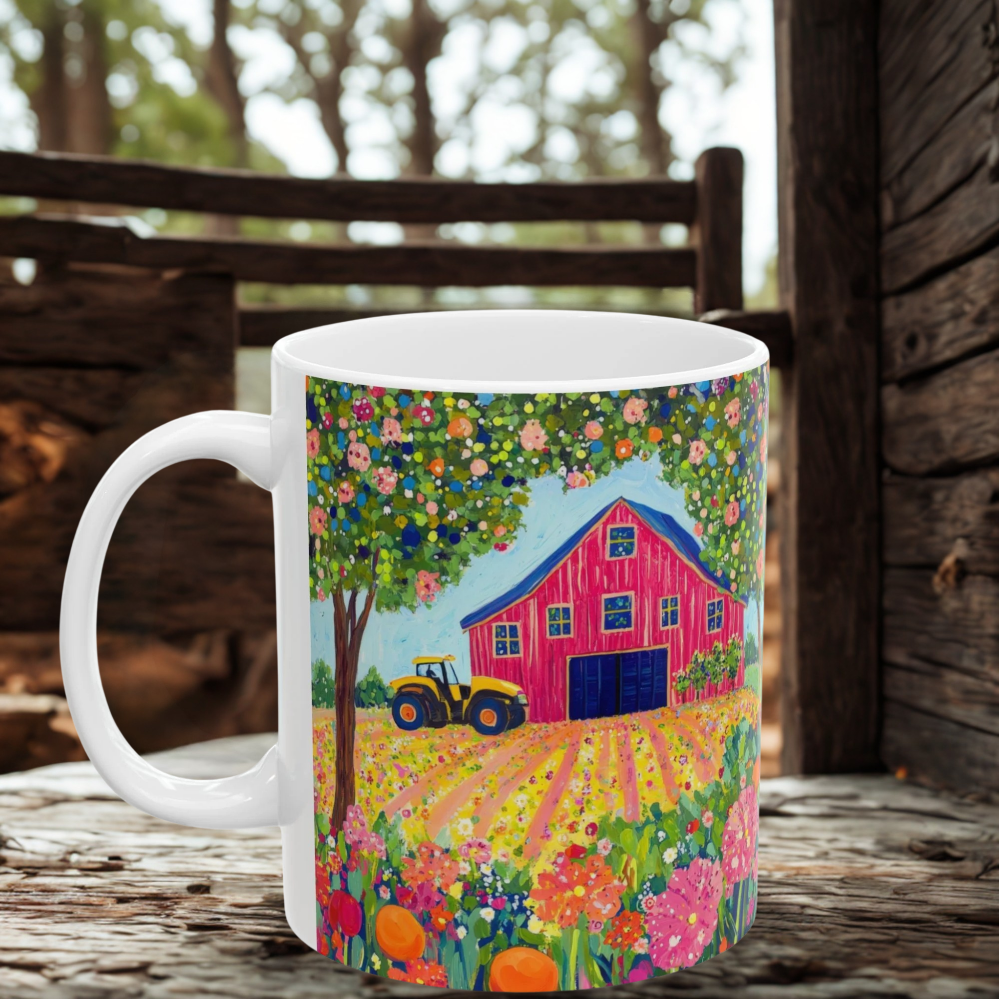 Mug with a colorful design of a barn and tractor on a wooden surface.
