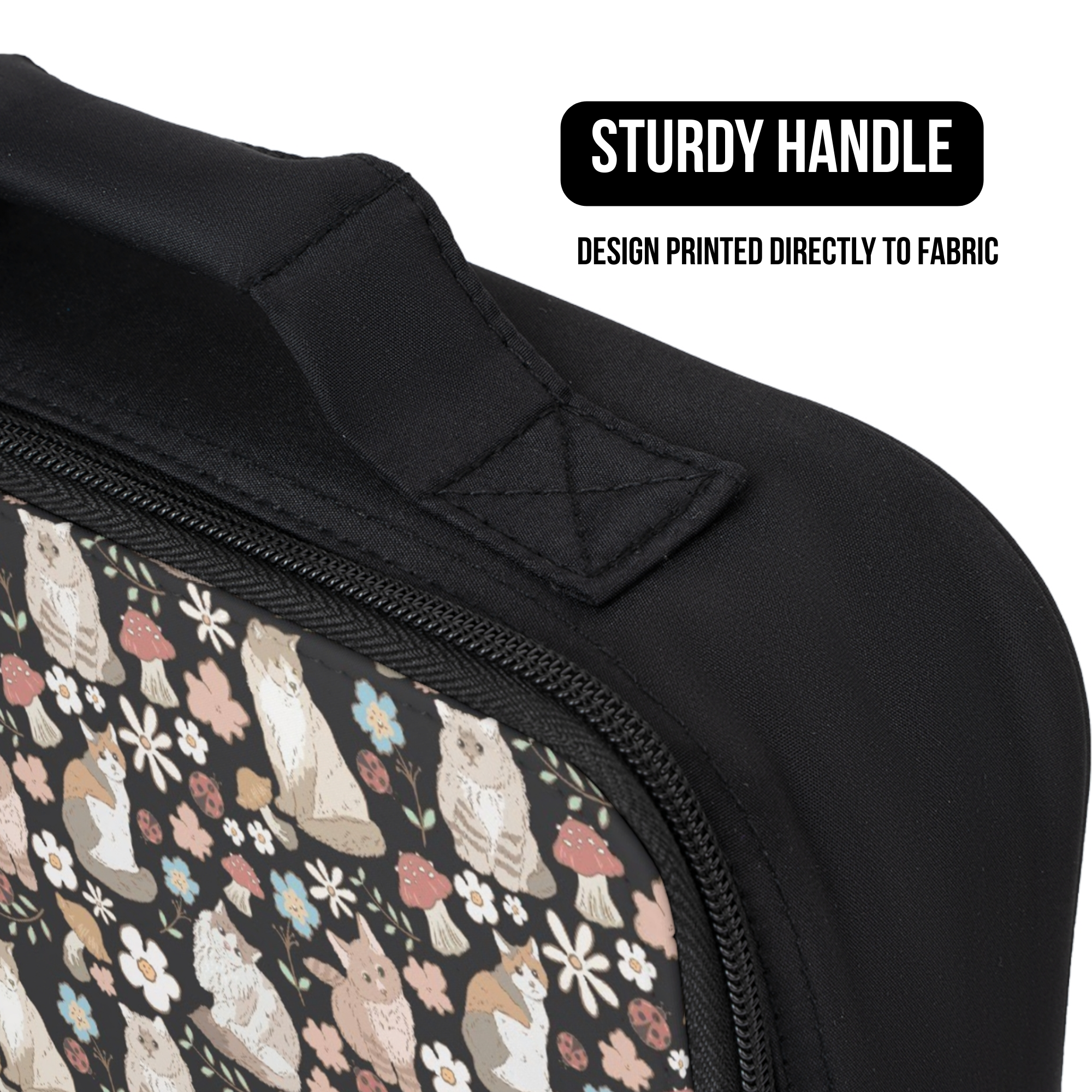 Black lunch bag with a pattern of cats and flowers, featuring a sturdy handle.