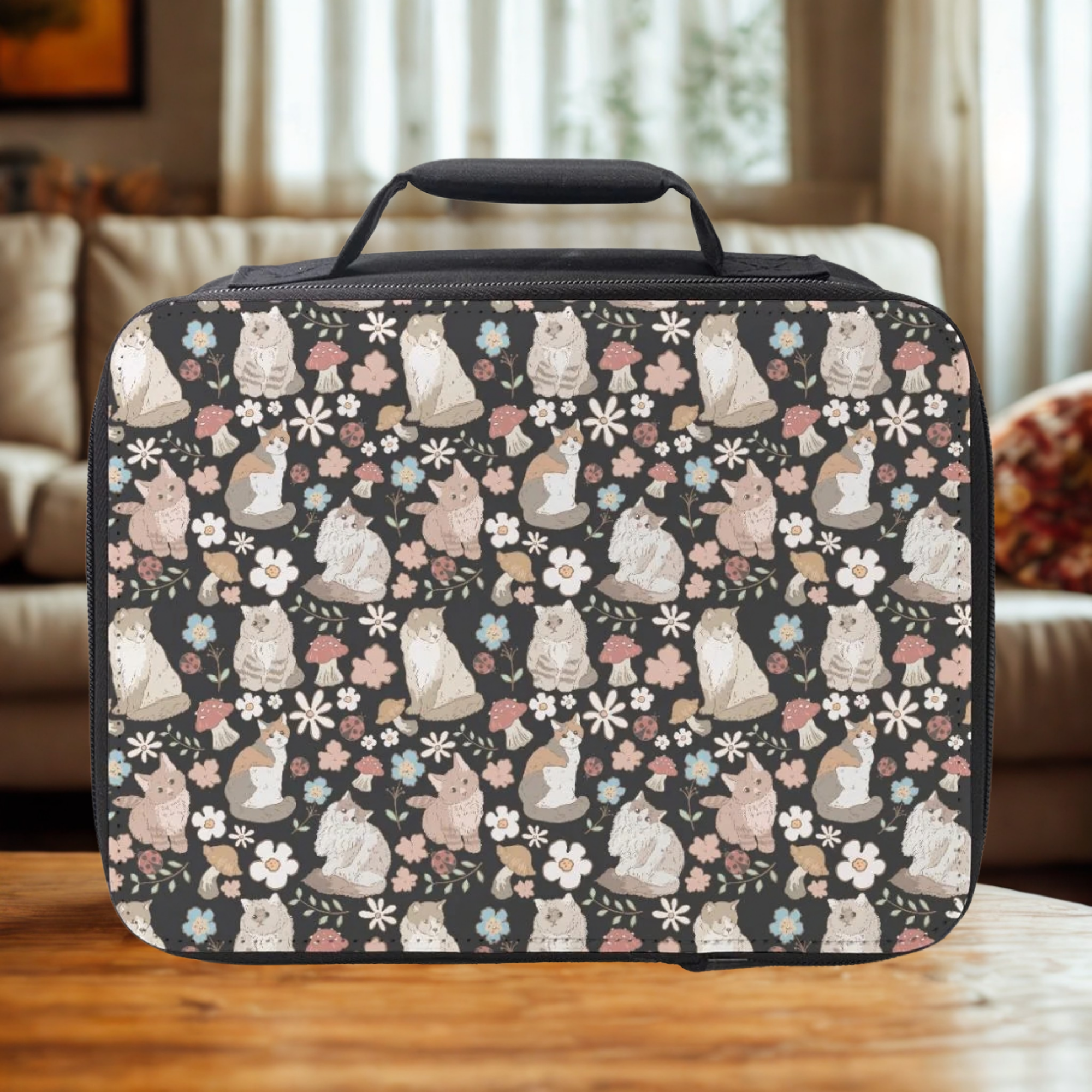 Patterned lunch bag with cat design on a wooden living room table