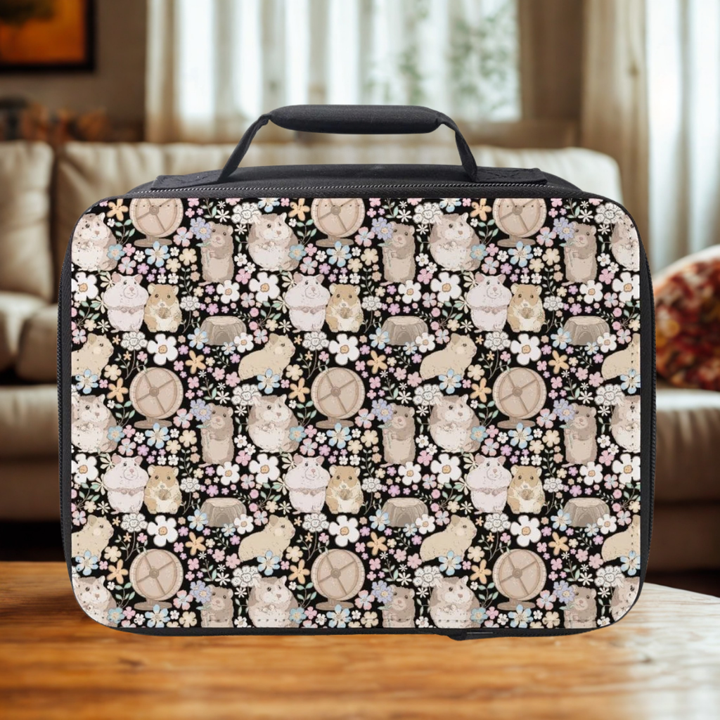 Black lunch bag with hamster and flower pattern on a wooden table in cozy living room.