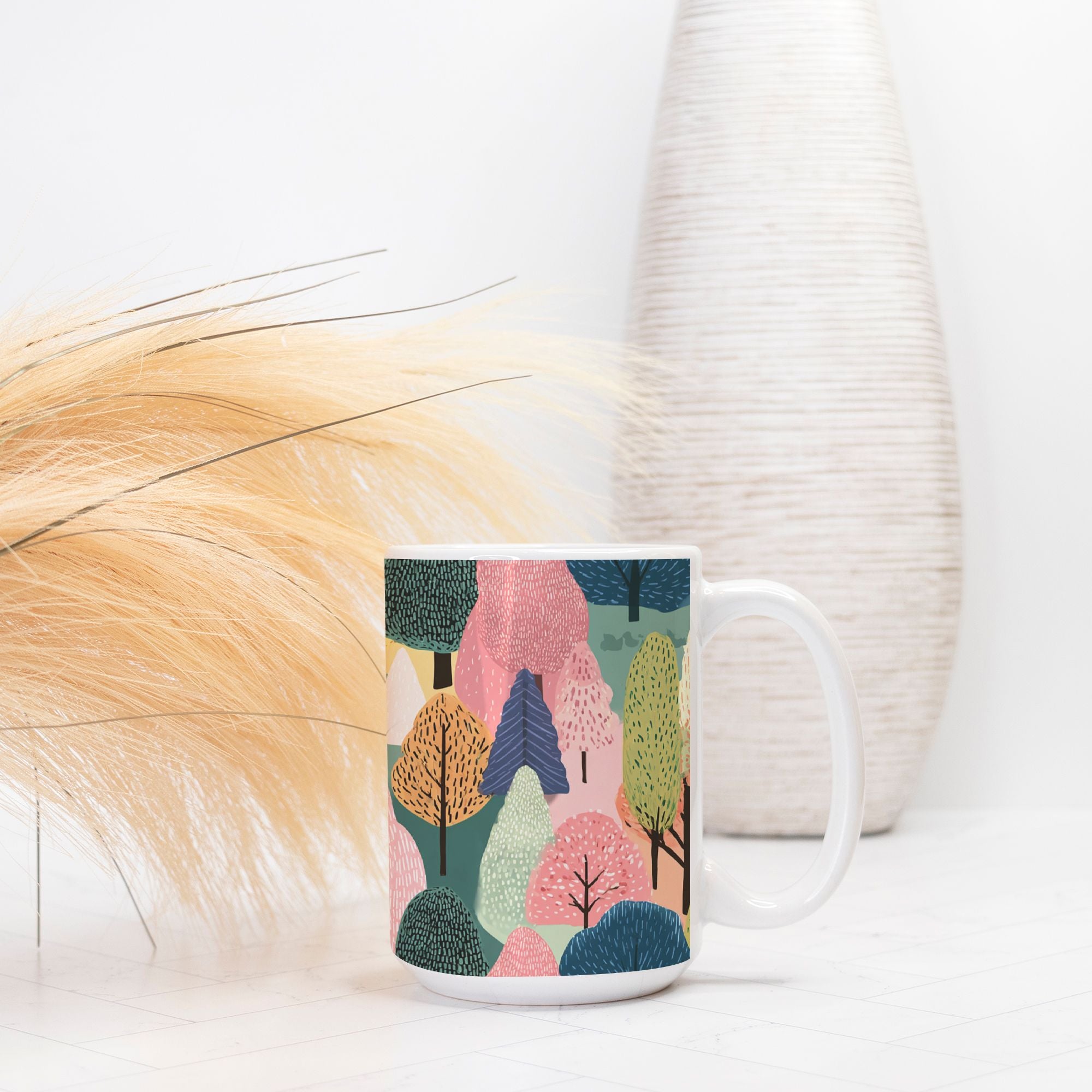 Mug with colorful forest design on a white surface with decorative elements