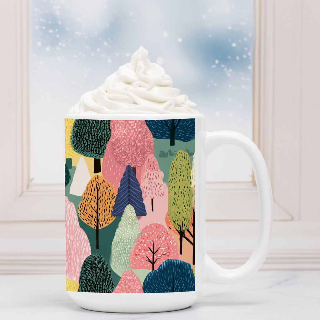 Mug with colorful forest design filled with hot chocolate and whipped cream.