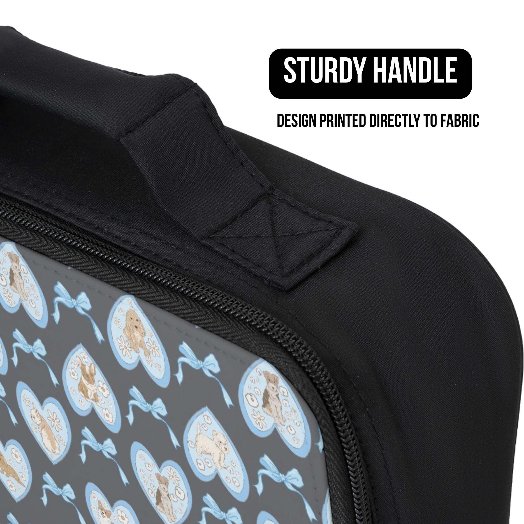 Black lunch bag with a heart and dog patterned design on a white background, featuring text about a sturdy handle.