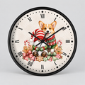 A round wall clock with a black frame and a festive Christmas-themed illustration of a corgi dog wearing a red and white striped sweater, surrounded by candy canes, gingerbread cookies, and ornaments on a light cream background.