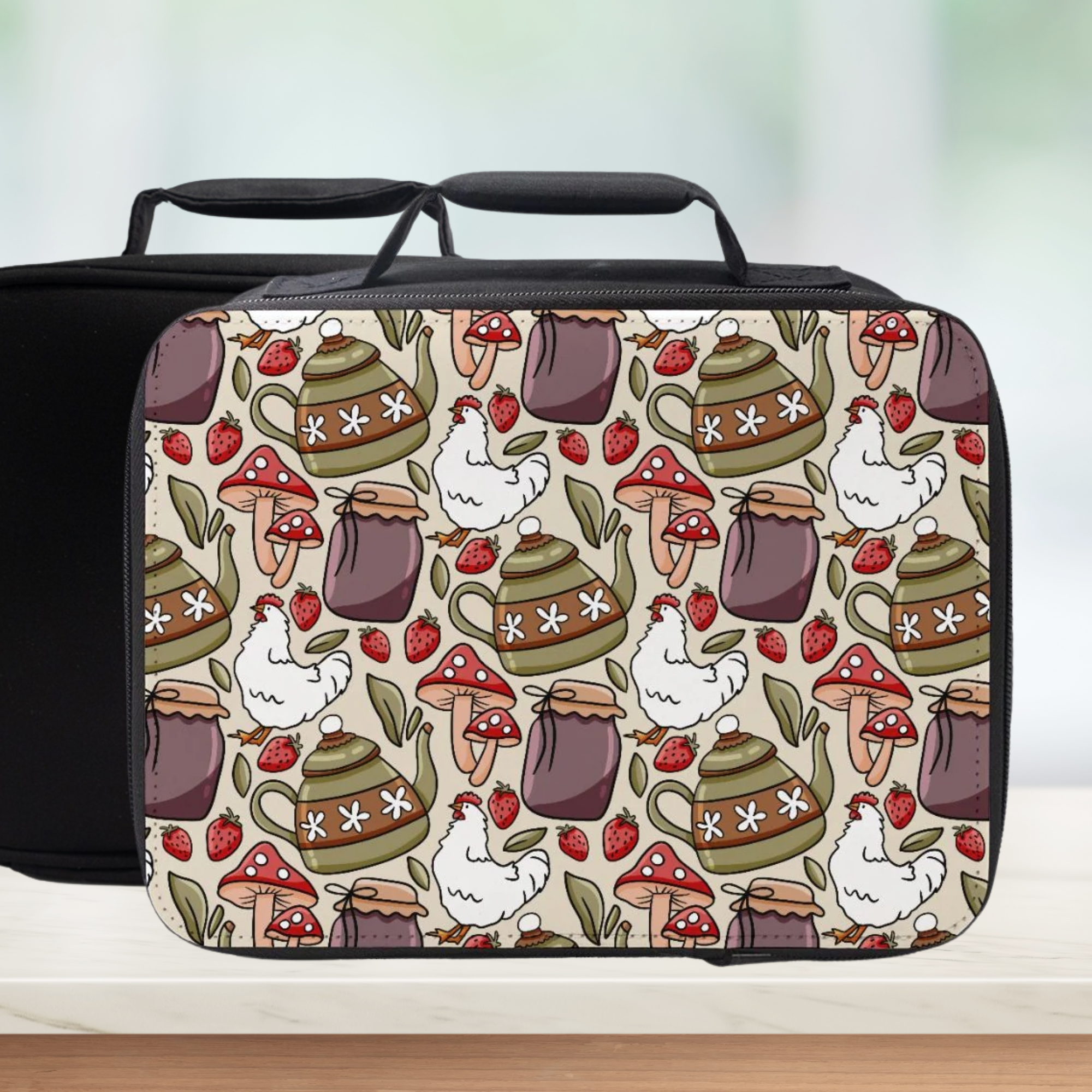  insulated lunch bag with a colorful pattern of teapots, chickens, and strawberries on a white background