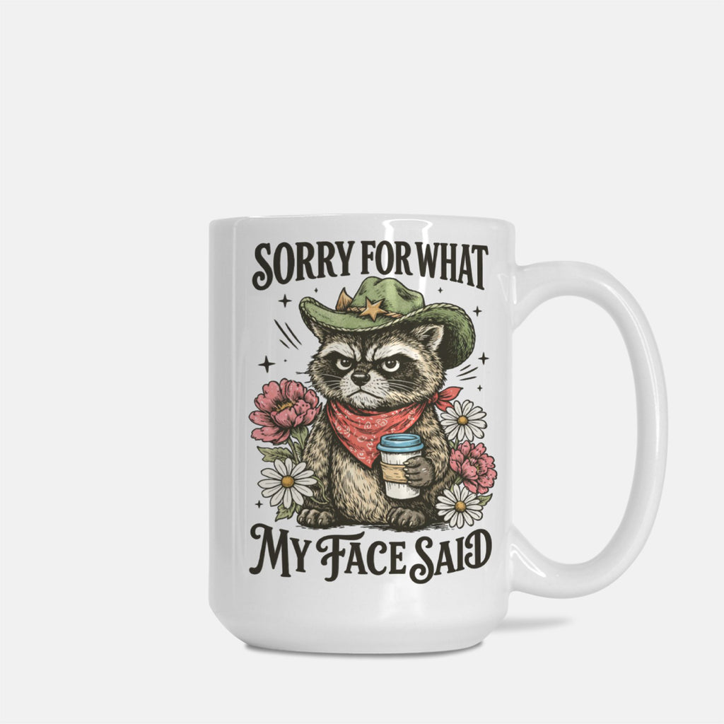 15oz. Mug with a raccoon illustration and text 'Sorry For What My Face Said' on a white background