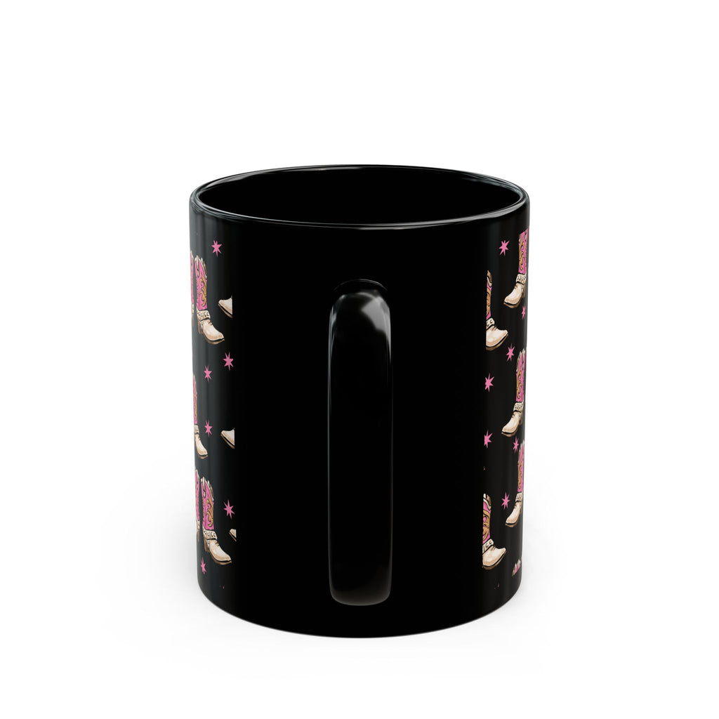 Black mug with a pattern of boots and stars on a white background
