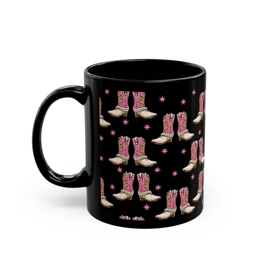 Black mug with pink cowboy boot pattern on a white background