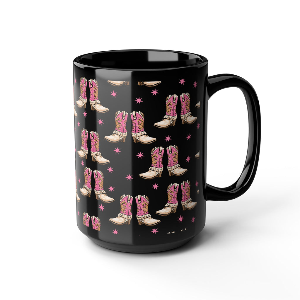 Black mug with pink cowboy boot pattern on a white background