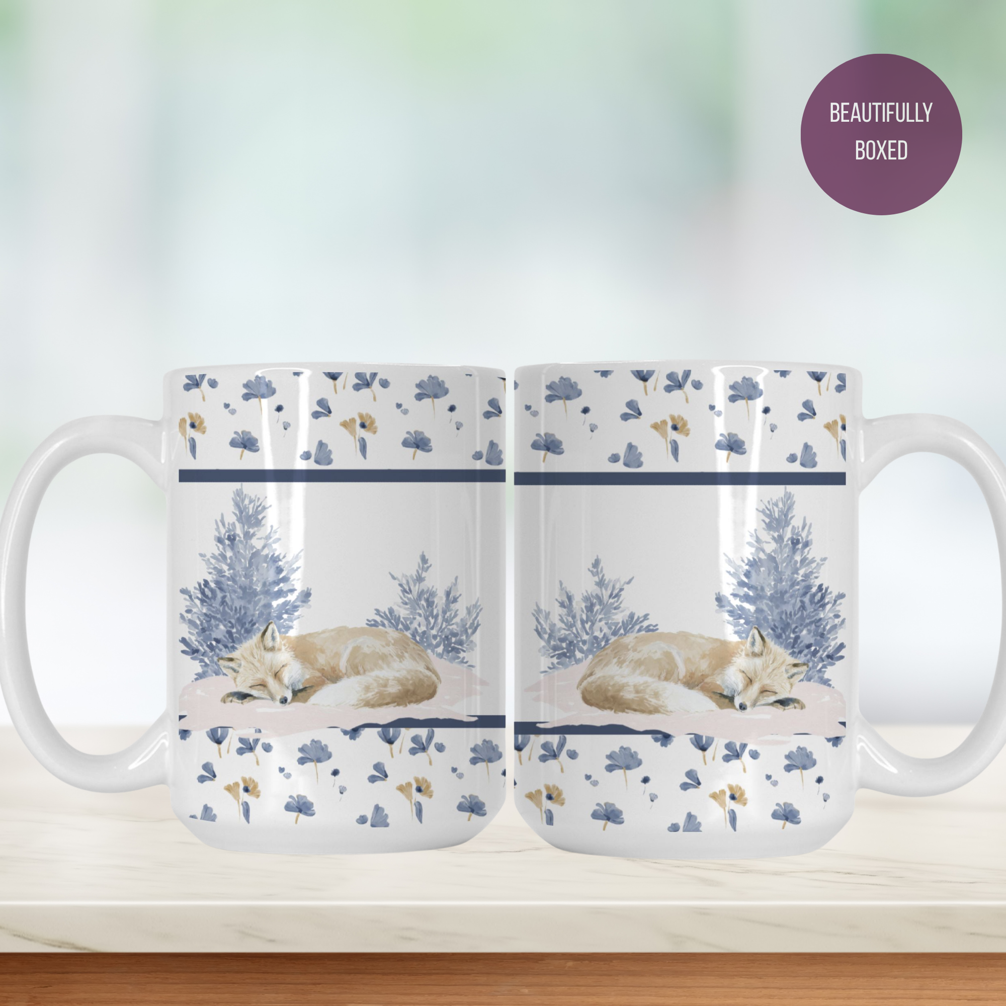 Two mugs with a design of a fox and trees on a white background