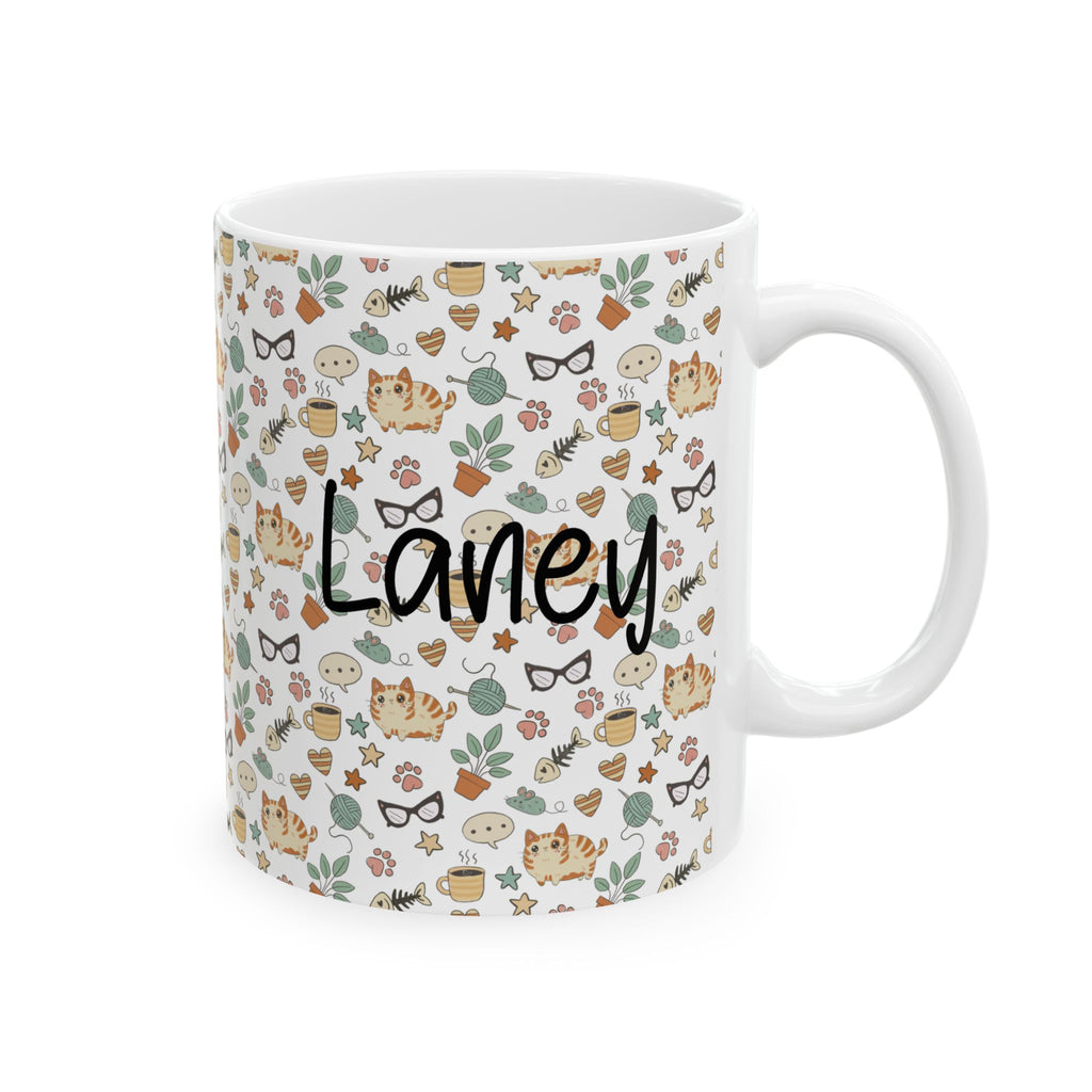 Mug with a pattern of cats, flowers, and the name 'Laney' on a white background