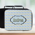 Coquette floral patterned lunch bag with 'Andrea' personalized name on a blurred background